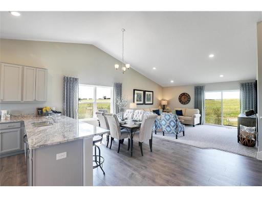 The vaulted ceiling and well placed windows and doors allows for plenty of natural light!