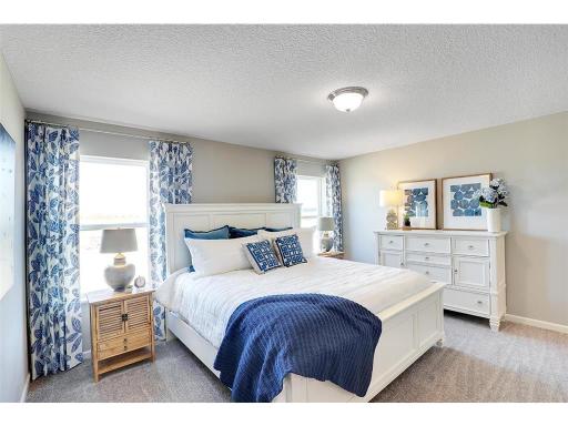 The primary bedroom is spacious and bright