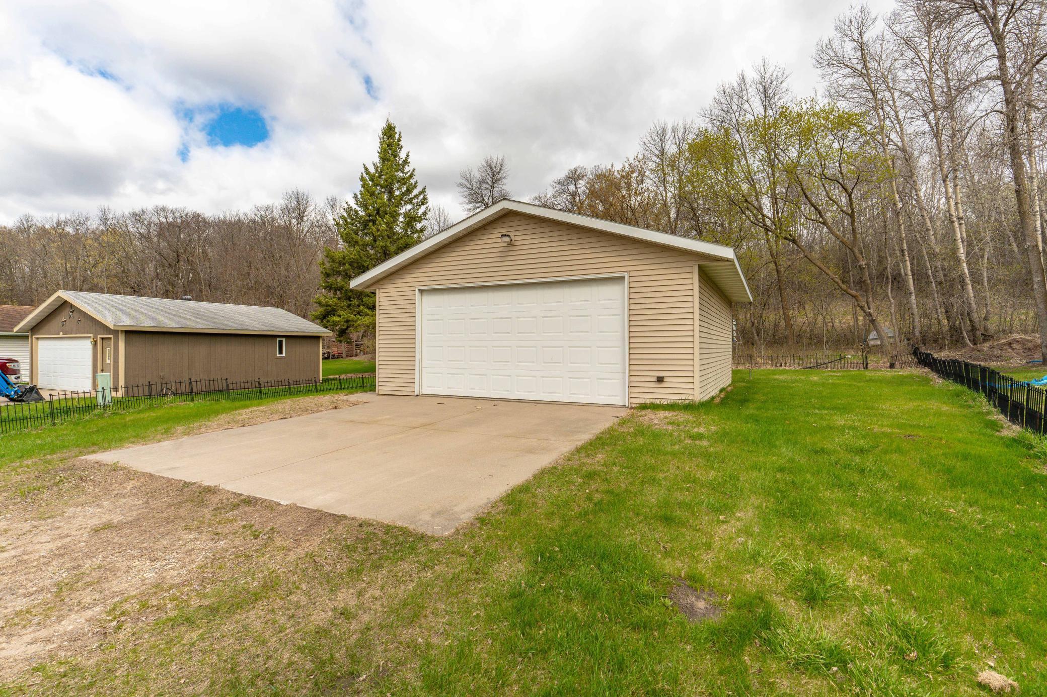 Fantastic garage space with a concrete driveway.