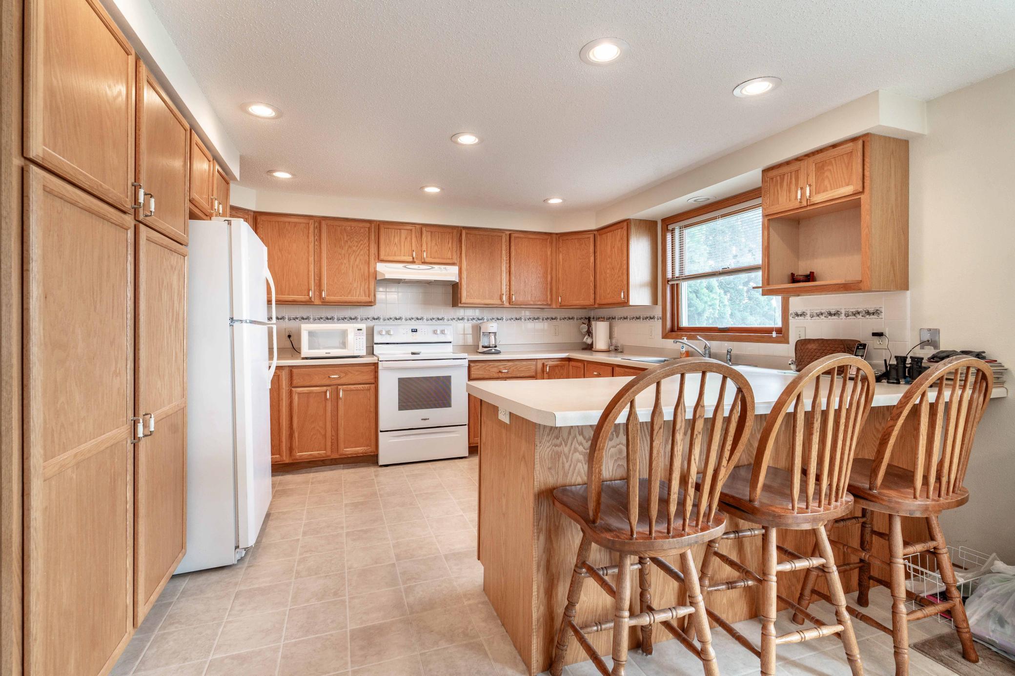 Fantastic kitchen with lots of cabinets and views of the lake while doing dishes!