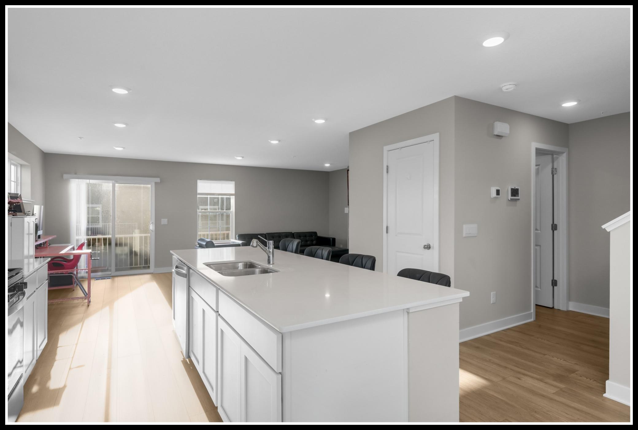 Kitchen opens to the living and access to the balcony