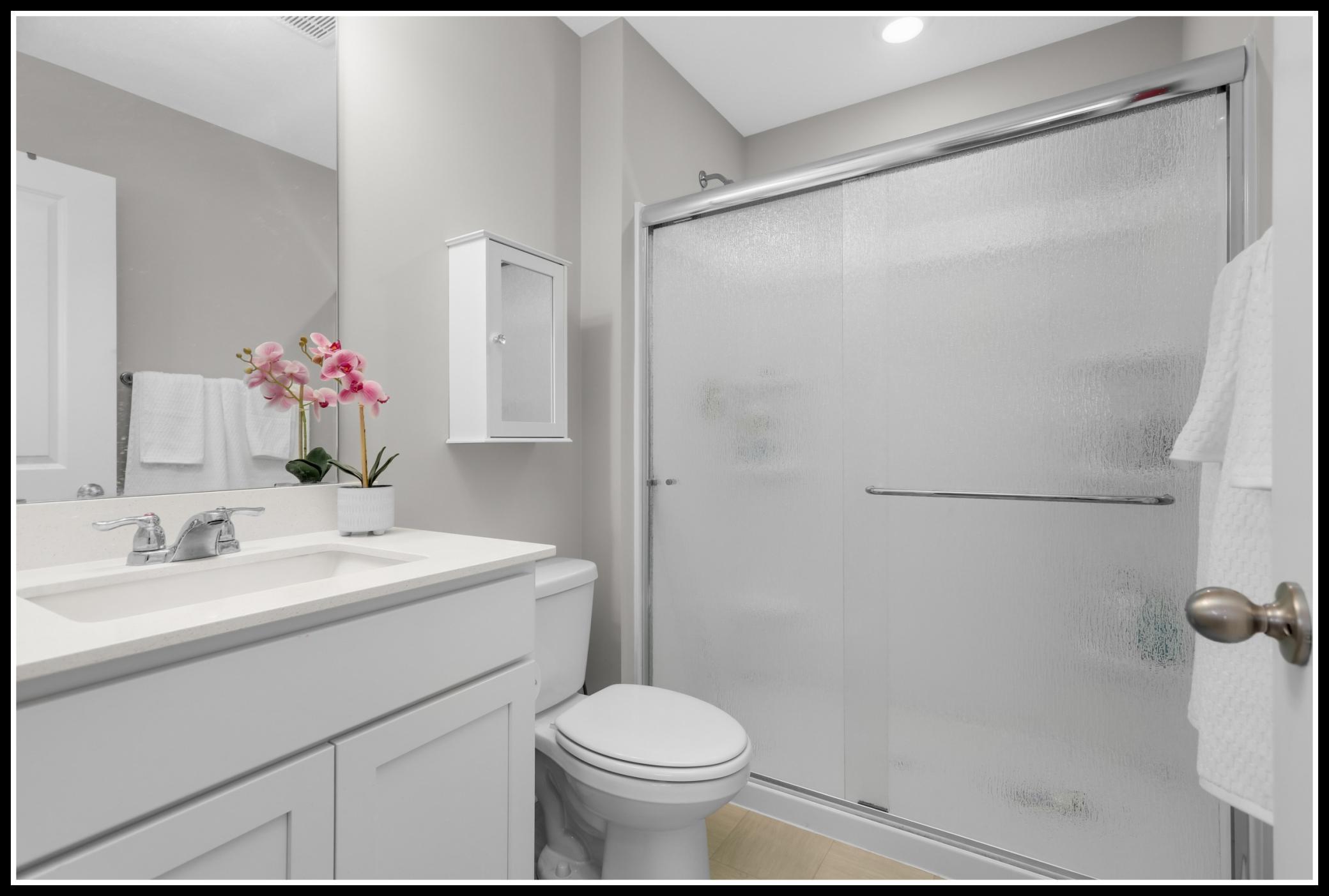 Private 3/4 bathroom serves the primary bedroom