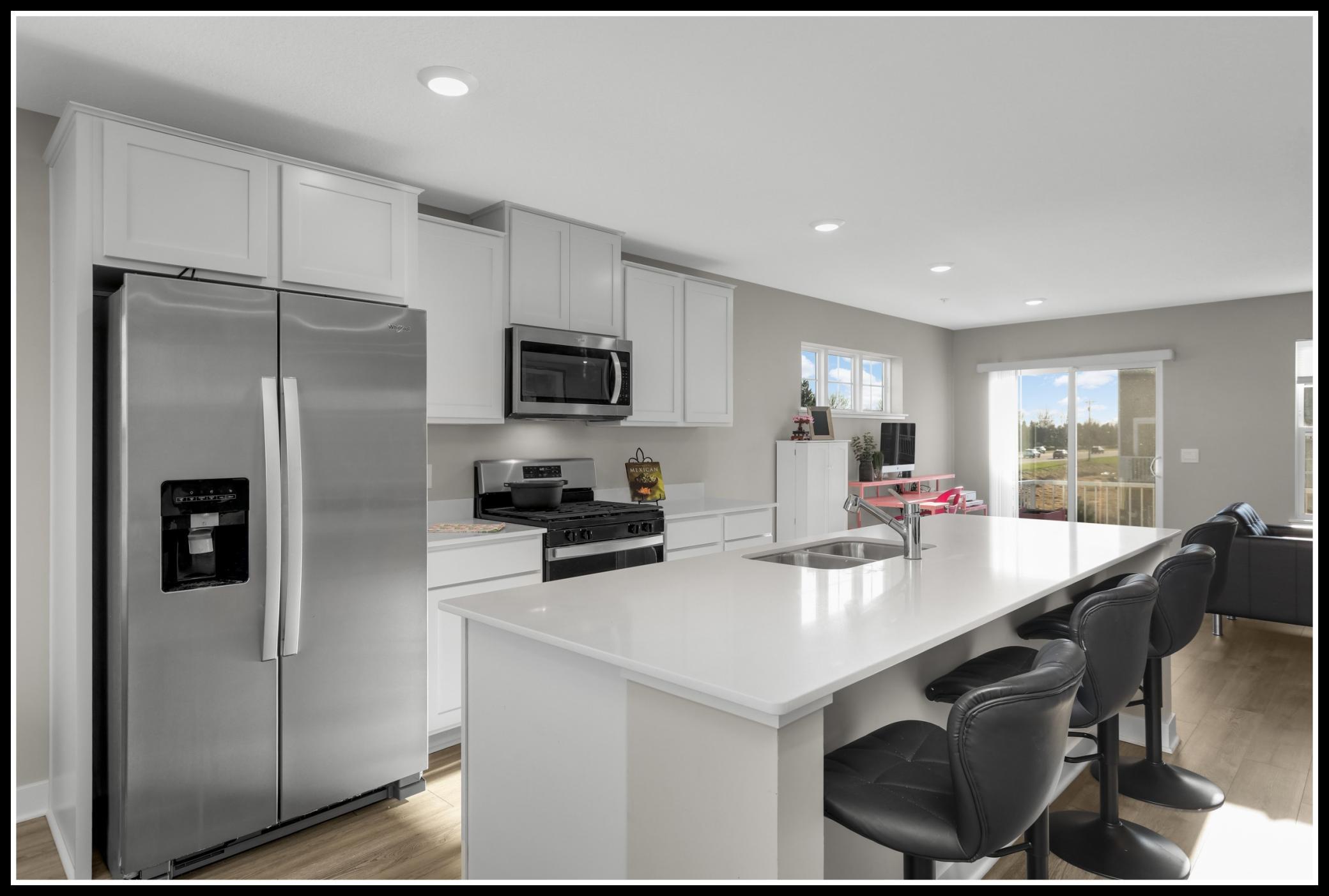 White quartz counters and stainless steel appliances