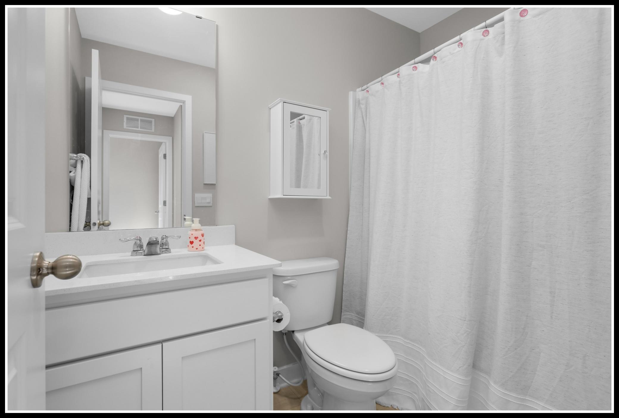 A full bathroom on the upper level serves bedrooms 2 and 3