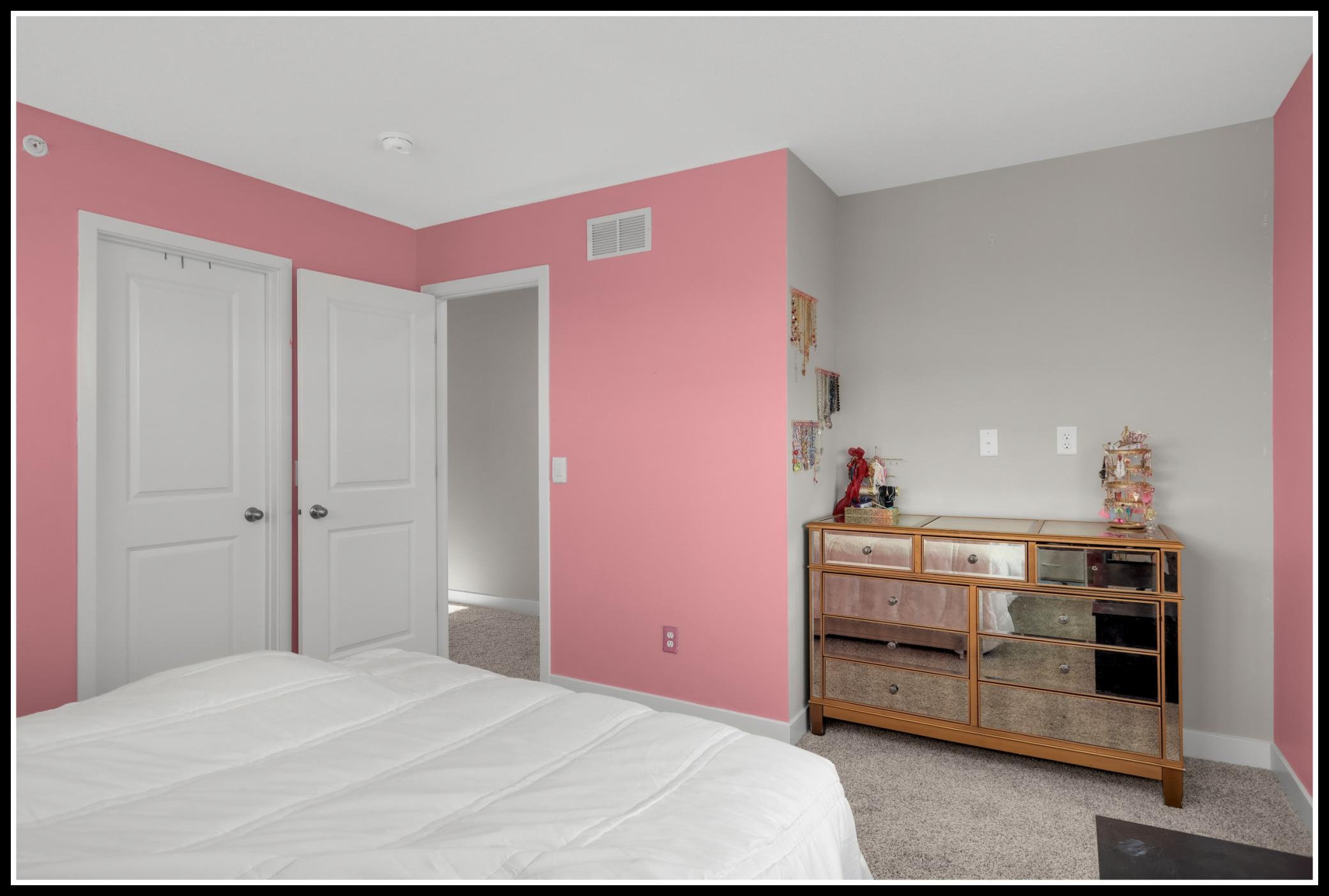 A walk-in closet hides behind the door at left