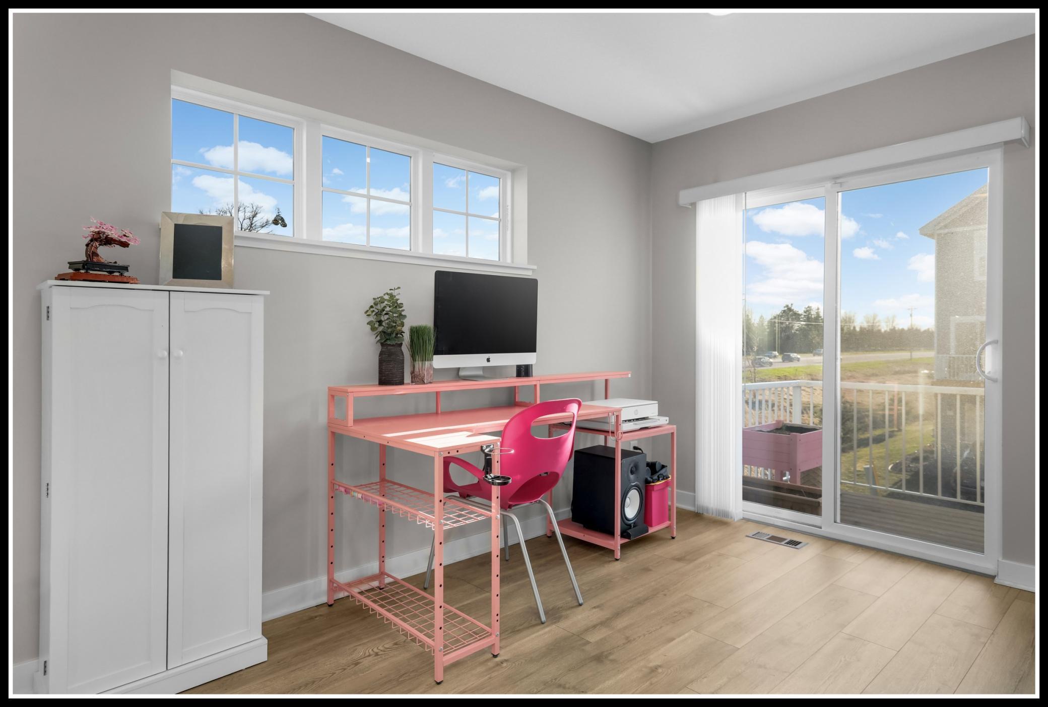 Extra main level space perfect for a workspace, lounge area, or alternative dining space