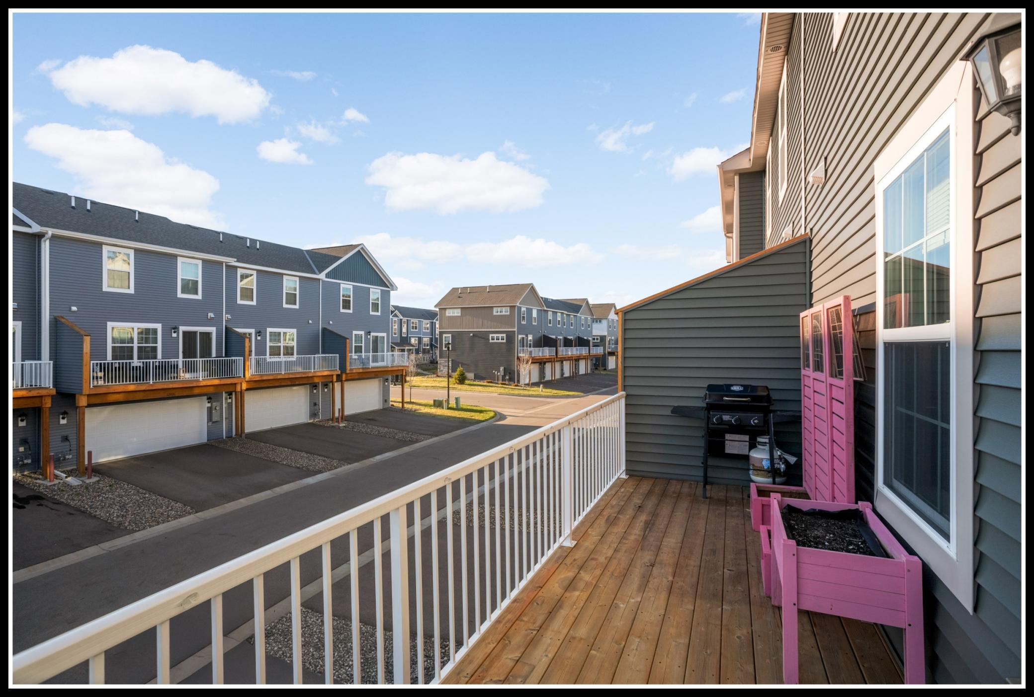 Sunny balcony with space for grilling, seating, and container gardening