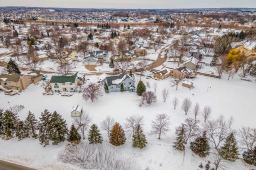 Aerial perspective showcasing the homeâs generous lot size, mature trees, and scenic neighborhood setting.
