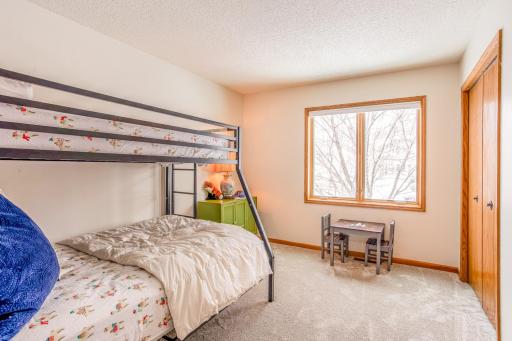 Versatile bedroom space featuring a large window and flexible layout to suit a variety of needs.