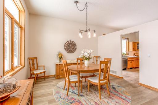 Bright dining area with open access to the kitchen, offering an ideal setup for both casual meals and formal entertaining.