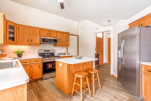 Functional kitchen design with stainless steel appliances, ample prep space, and seamless flow to adjacent living areas.