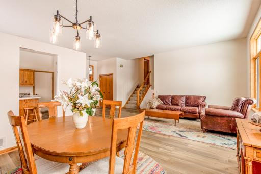 Open and airy main level showcasing the seamless flow between living, dining, and kitchen spaces.
