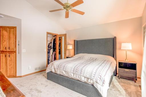 Generous primary suite with ample space for furnishings, including a walk-in closet and comfortable layout.
