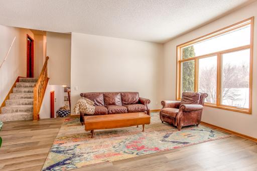 Comfortable living room featuring large picture windows and plenty of natural lightâperfect for relaxing or hosting guests.