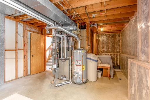 Large utility and mechanical room offering ample storage and easy access to home systems.