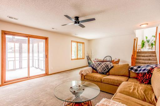 Spacious family room with abundant natural light, walkout access, and plenty of room for relaxing or entertaining.