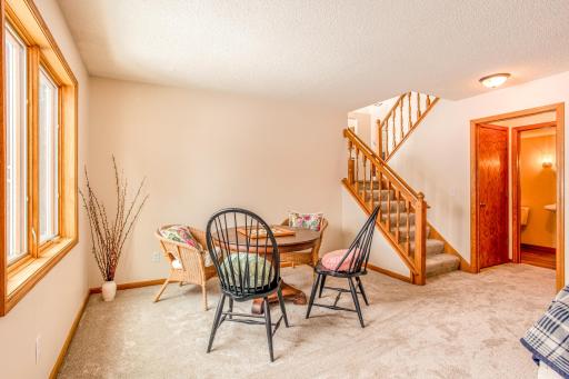 Charming dining or game area tucked beside the windowâperfect for casual meals or gatherings.