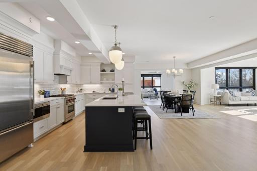 Open-concept layout designed for effortless flow into the informal dining space and other living spaces.