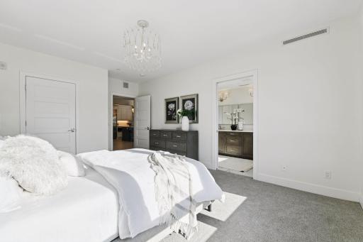 Spacious primary bedroom with an en-suite full bath