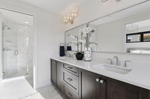 Spa-like retreat with tile flooring, a soaking tub, and a spacious walk-in shower