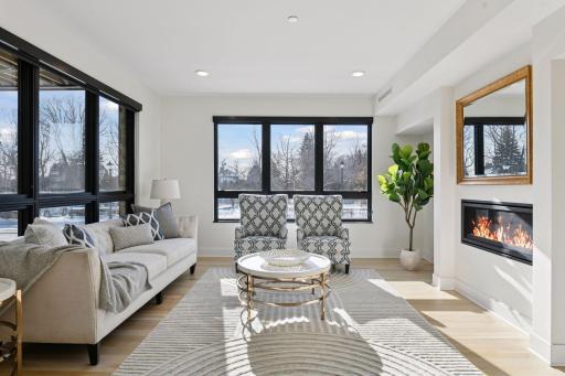 Cozy living room with gas burning fireplace and wonderful views of Lake Street in Wayzata