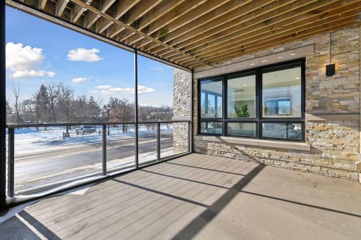 Enjoy grilling or unwinding on the deck overlooking Lake Street in Wayzata