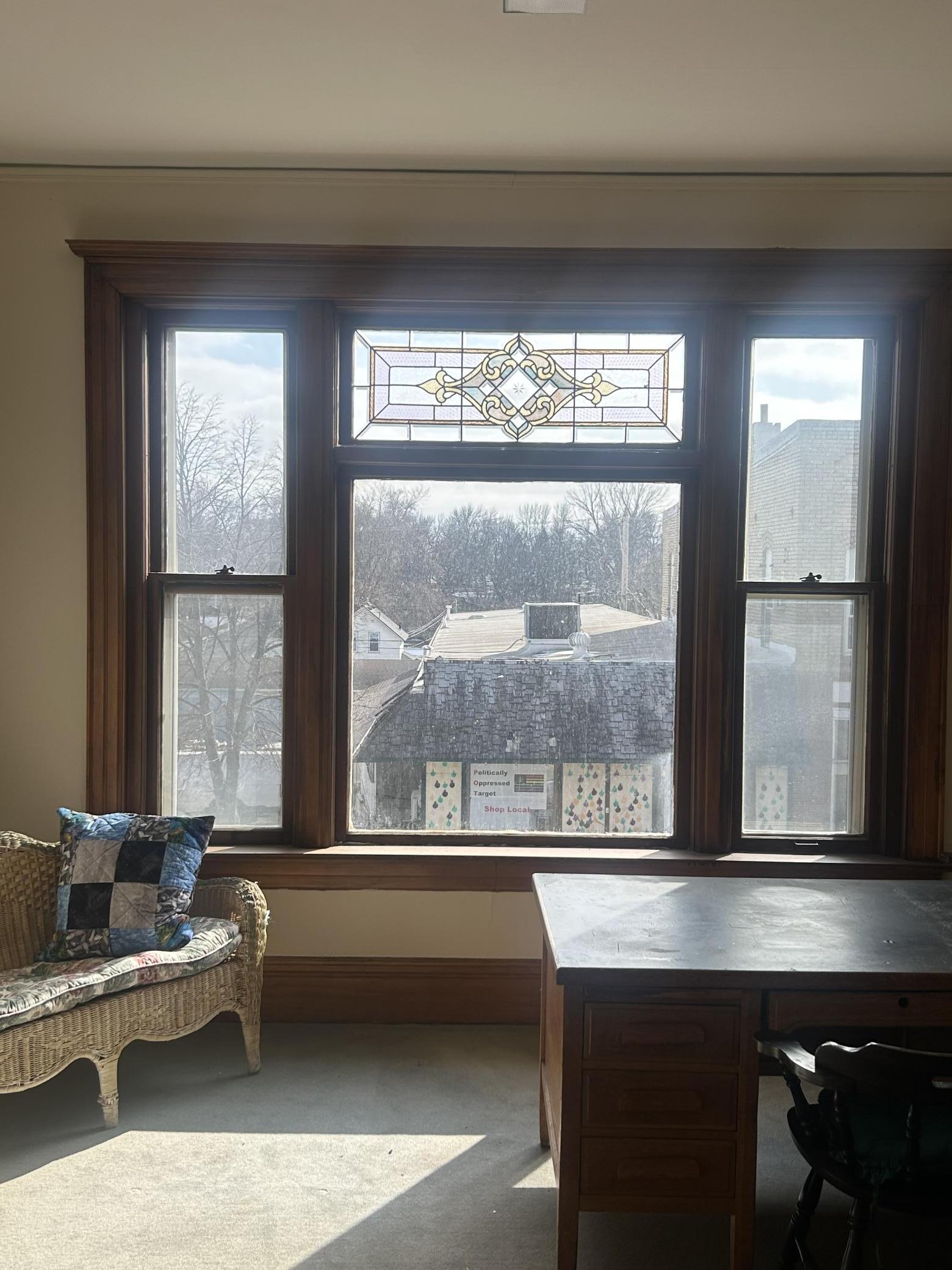 Eight foot windows, this one features stain glass with southern natural lighting exposure.