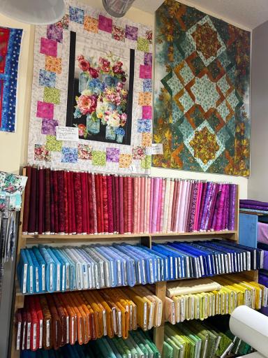 Main level 2200 sf of open floor displays vivid and beautiful fabrics featuring bold, high-contrast colors like electric blue, bright red and neon pink. Moving sale April 1 - May 30. Send your crafters.