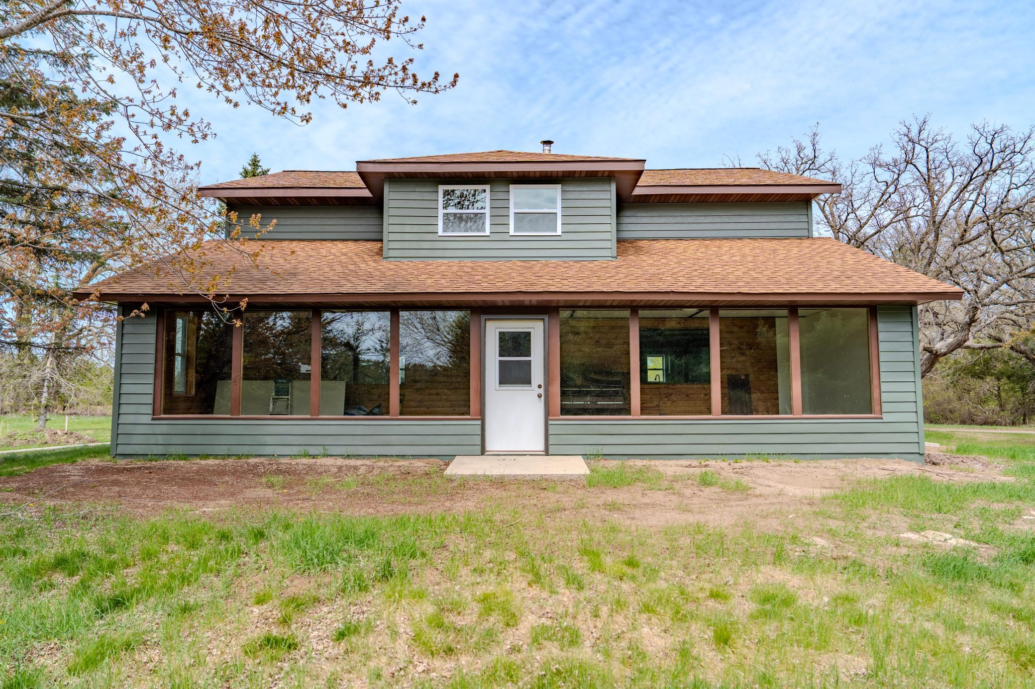 Front view of home with large windows