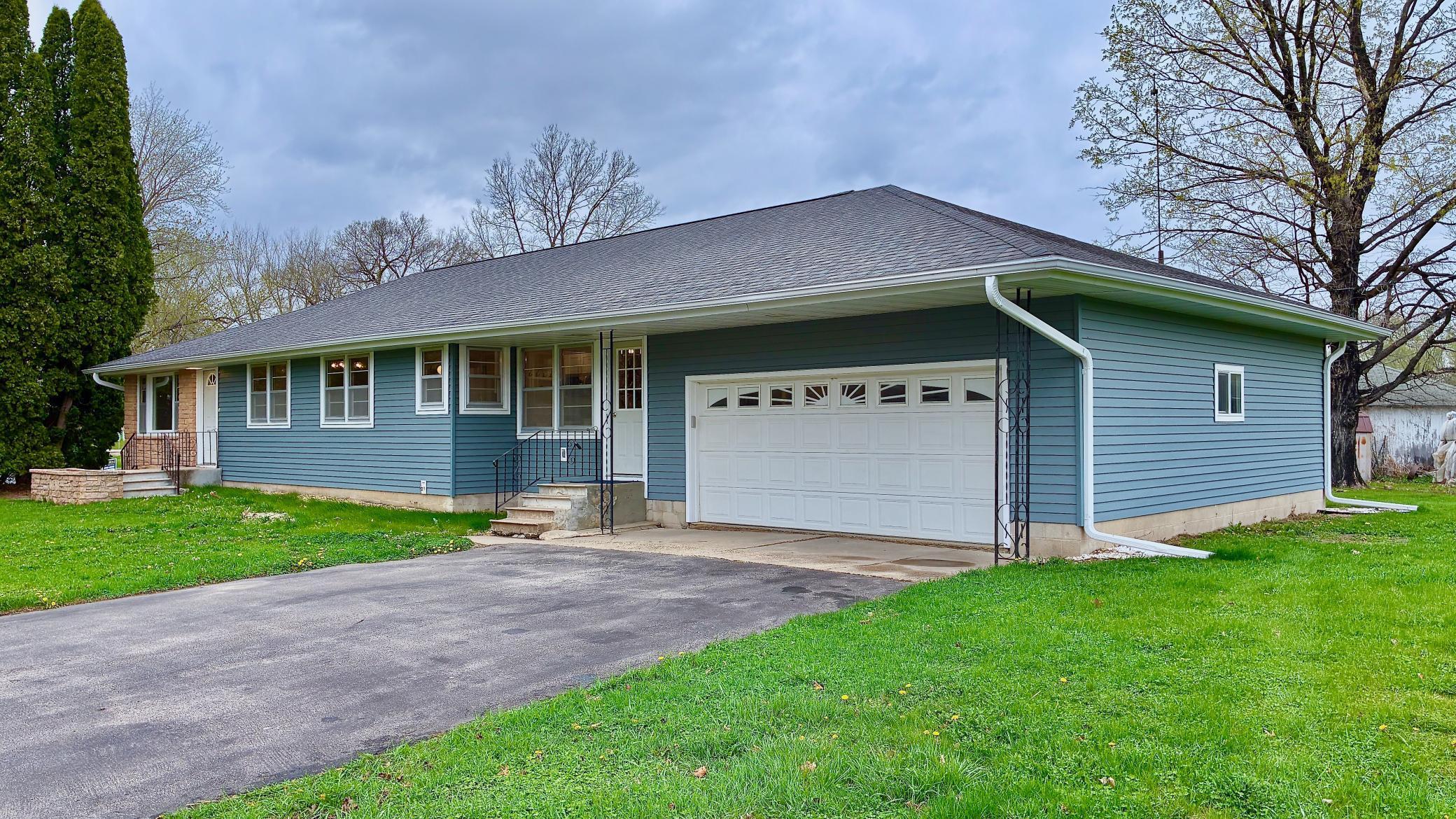 Welcome home! This mid-century modern beauty boasts gorgeous new updates paired with vintage charm and the convenience of one level living. Door on left enters into the living room. Door on right enters into the mudroom.