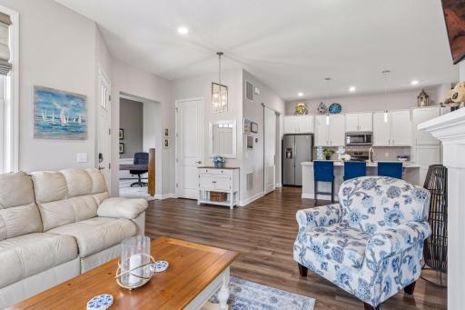 into a stunning chefâs kitchen with upscale finishes, center island,
