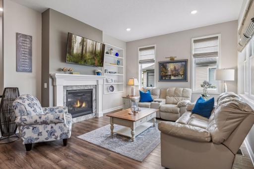 Sun-splashed, open-concept living room flows ...