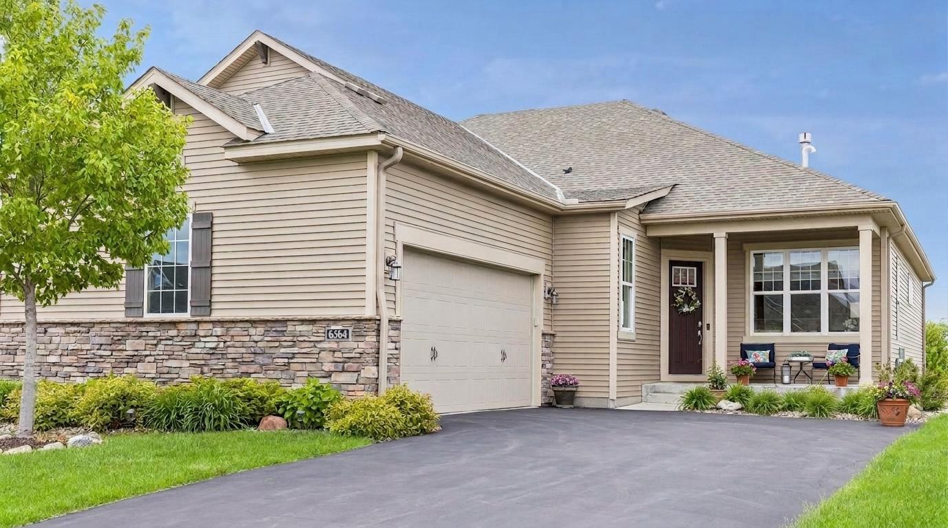 Sophisticated one-level living in a beautifully finished walkout townhouse.