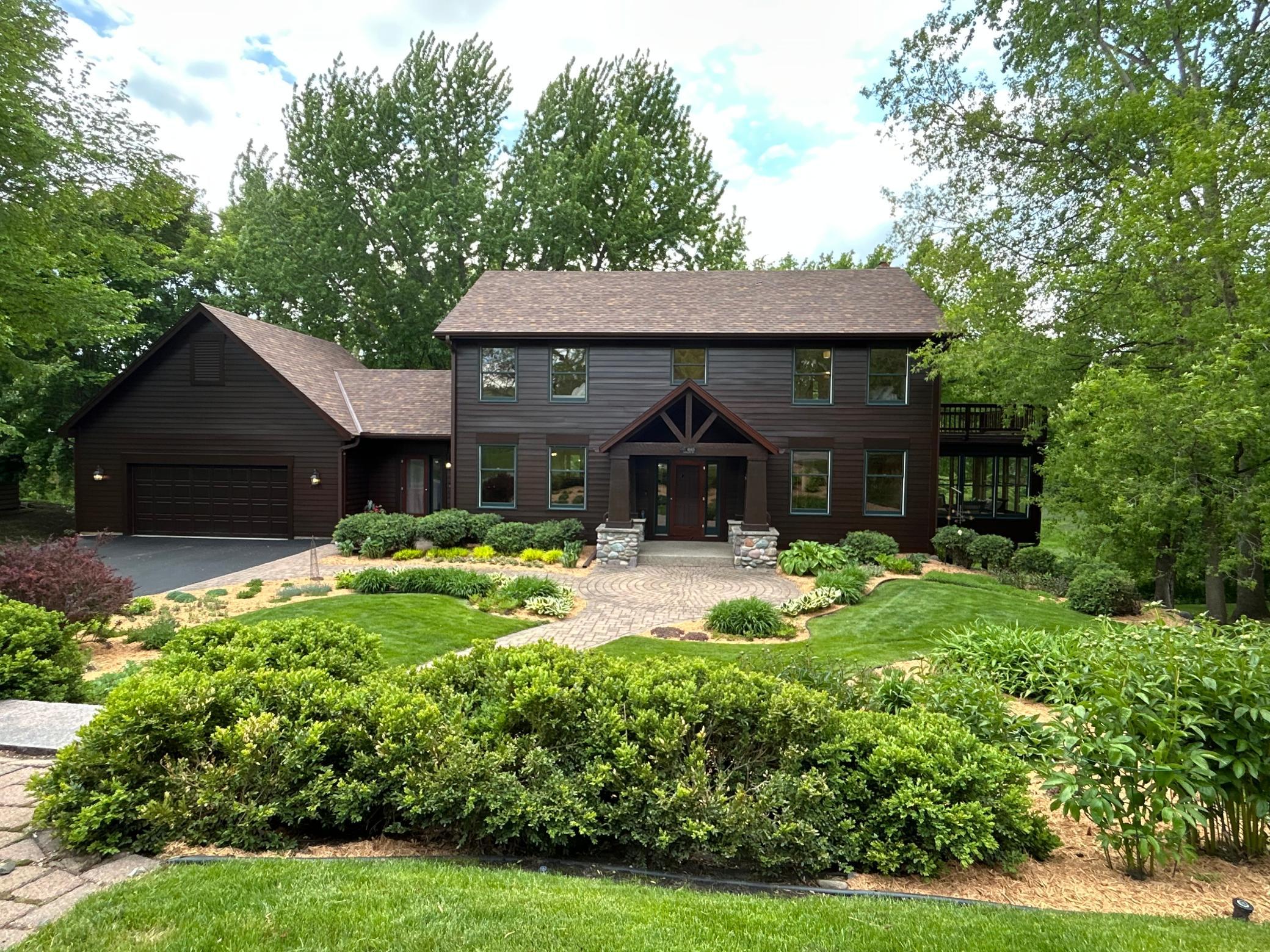 Welcome to 4845 Hamilton Road. This home offers four garage spaces with two on the main level and a paved driveway leading around the home to the lower level two car spancrete garage.