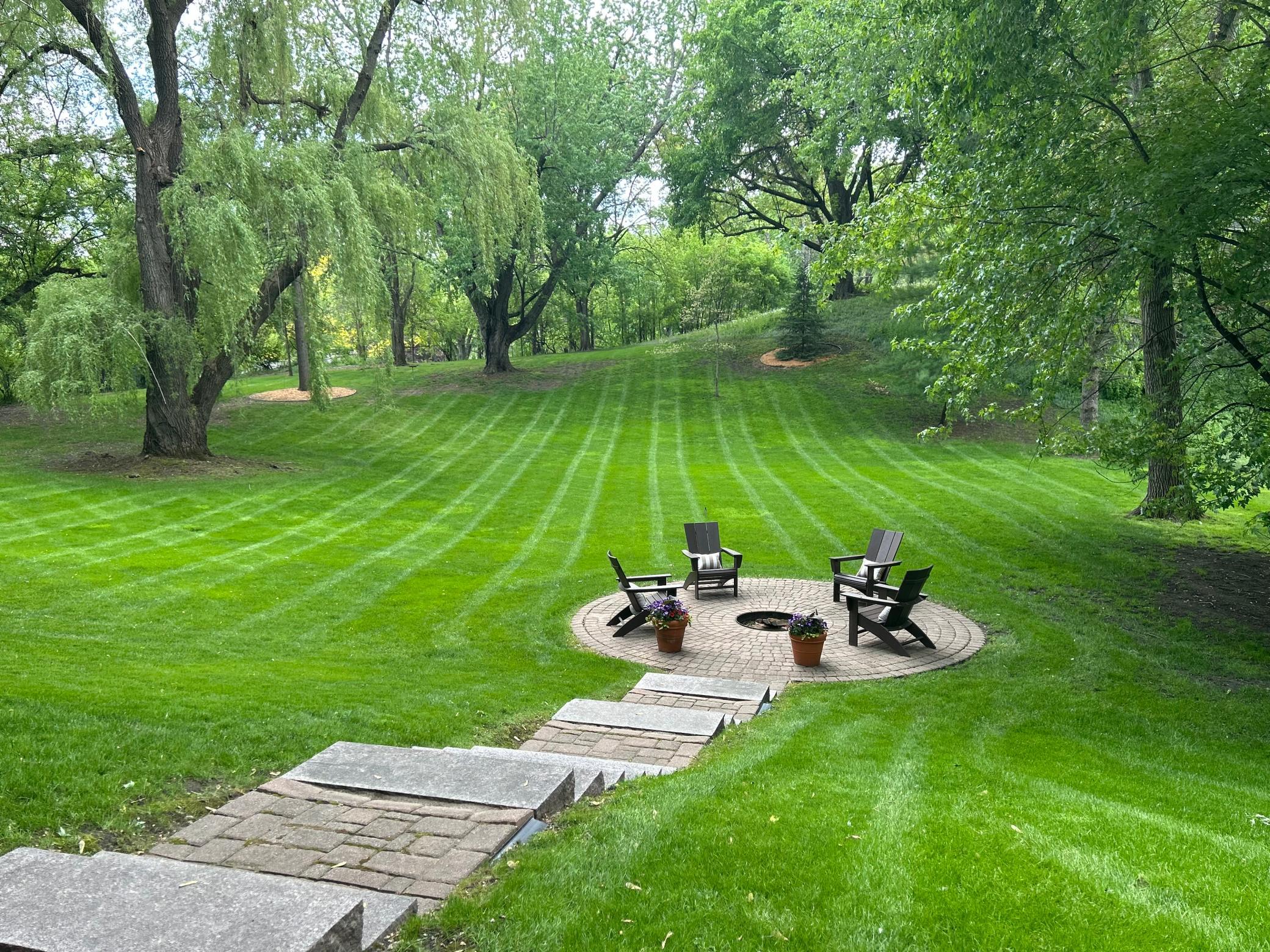 Surrounded by beautiful landscaping, you'll enjoy custom paver patios and a picturesque setting.