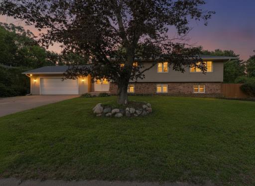 Welcome home! This stunning Shoreview property greets you with a spacious lawn, mature trees, and that gorgeous sunset sky that just makes you fall in love at first sight. Curb appeal at its finest!