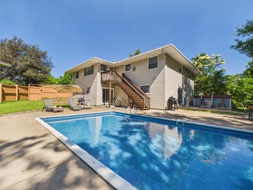 Your own backyard paradise Heated pool with a brand new liner, lounge chairs, and mature trees that give you complete privacy. This is the summer setup everyone dreams about!