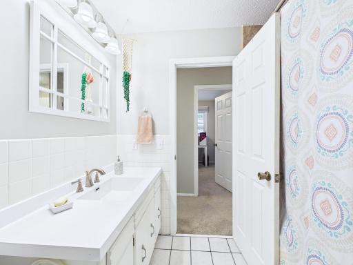 Bathroom Clean, bright, and full of charm Spacious vanity with a white countertop, classic tile, and fun details that make it feel like home. Move-in ready and waiting for you!