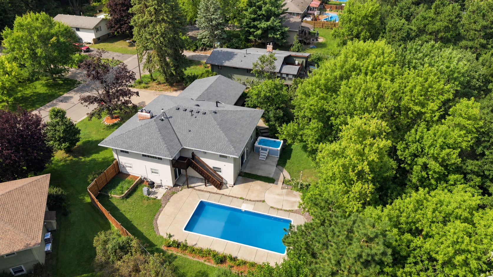 Beautiful backyard with heated pool and a swim spa.