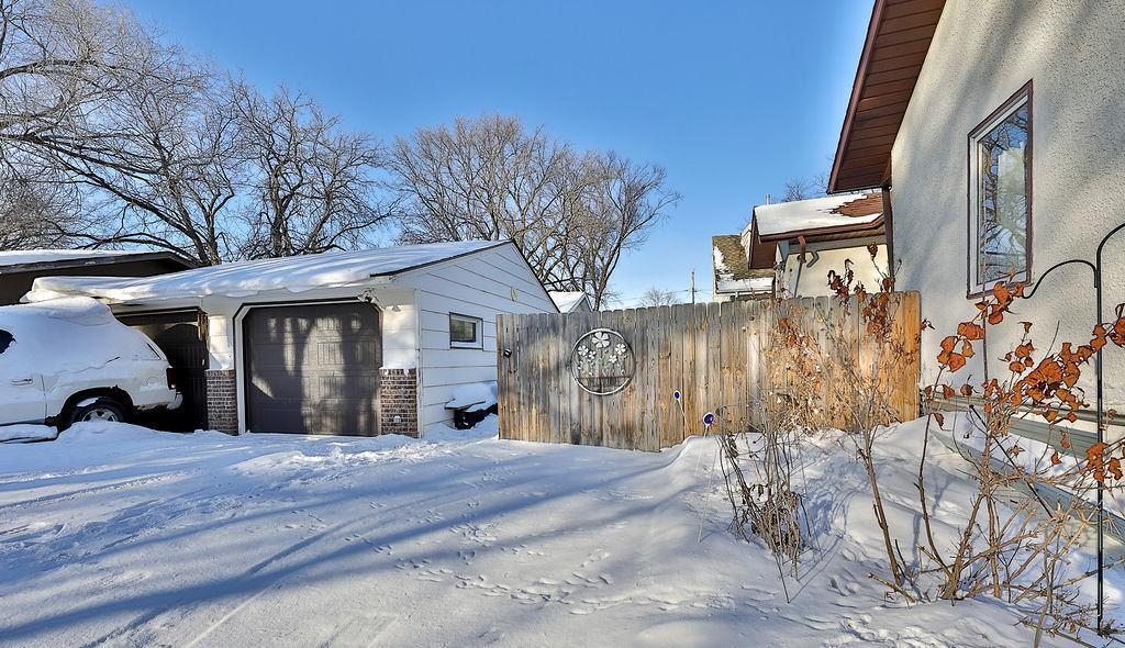 Partially fenced yard & 2-car garage