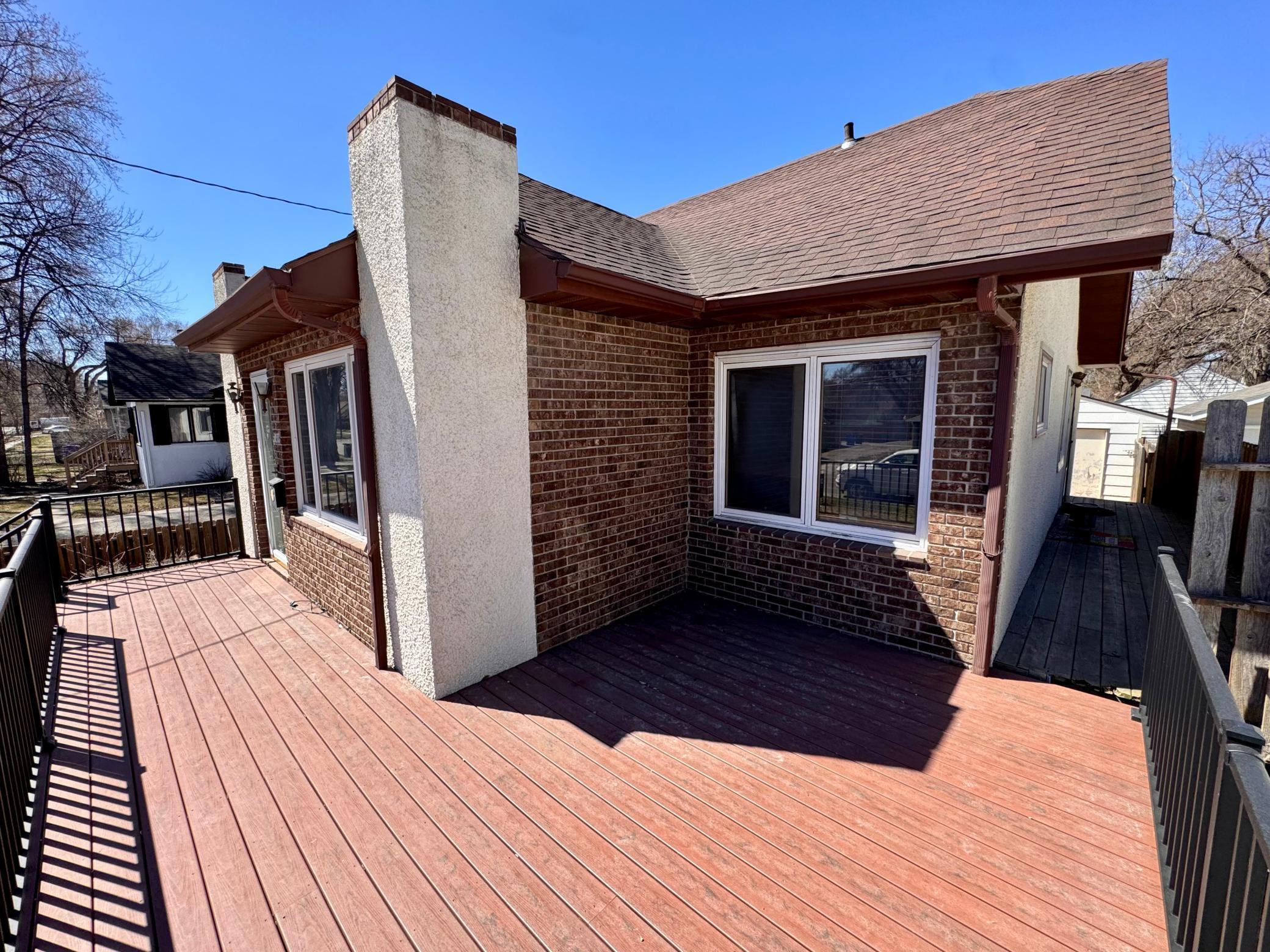 Large front deck that wraps to backyard