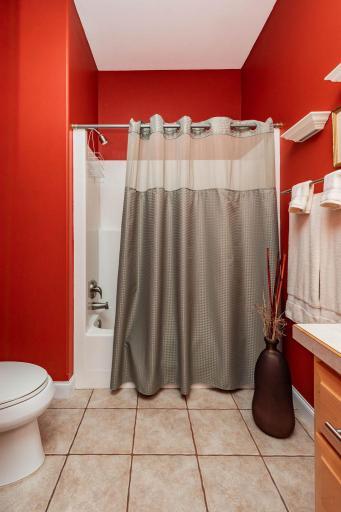 Full bathroom with tile floor