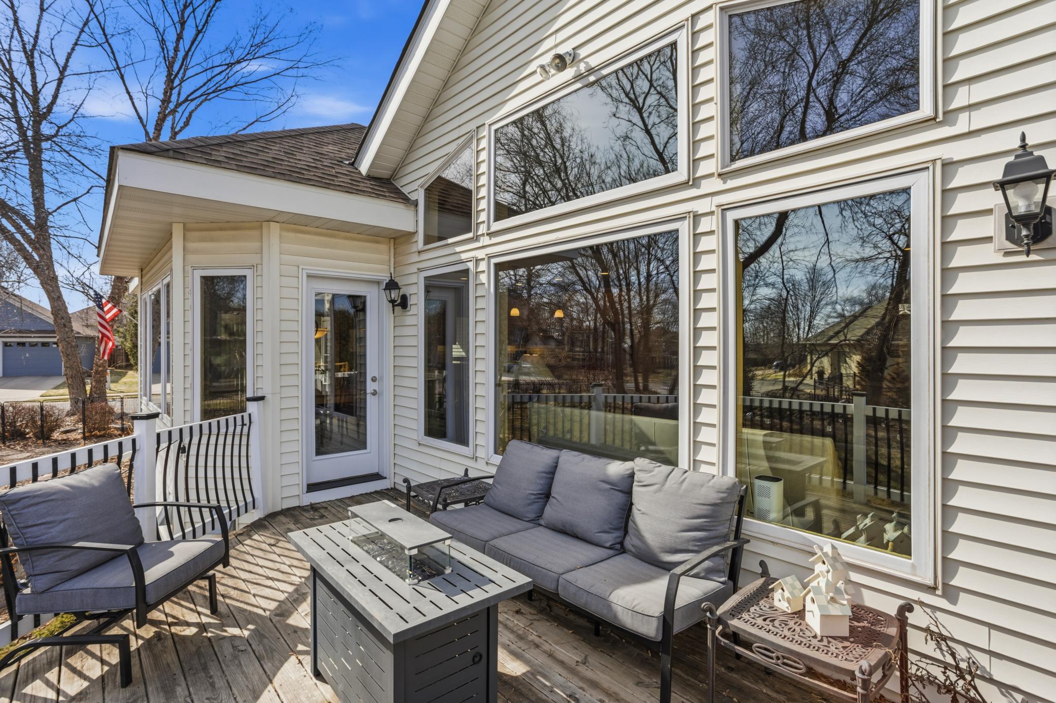 An additional charming deck off the main level overlooks the backyard, offering a serene spot for morning bird watching or simply relaxing.