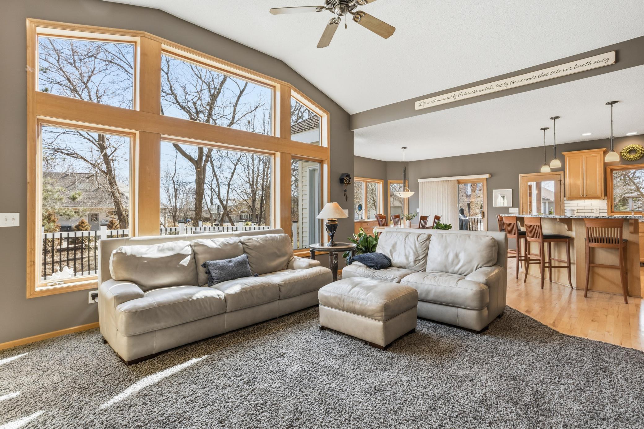 The open layout connects seamlessly to the kitchen and dining areas, creating a perfect space for both everyday living and entertaining.