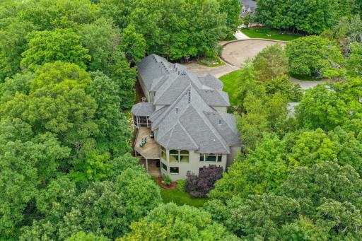 A serene, tree-lined Jack Nicklausâdesigned golf course nestled within a gated luxury community.