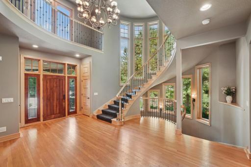 Inside, youâre welcomed by a sweeping grand staircase, a dramatic two-story foyer, and an impressive library.