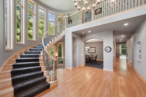 Inside, youâre welcomed by a sweeping grand staircase, a dramatic two-story foyer, and an impressive library.