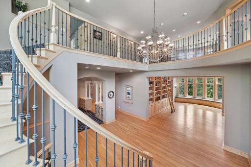 Inside, youâre welcomed by a sweeping grand staircase, a dramatic two-story foyer, and an impressive library