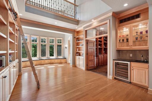 Inside, youâre welcomed by a sweeping grand staircase, a dramatic two-story foyer, and an impressive library