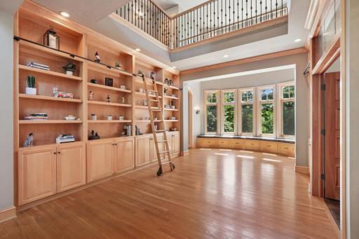 Inside, youâre welcomed by a sweeping grand staircase, a dramatic two-story foyer, and an impressive library